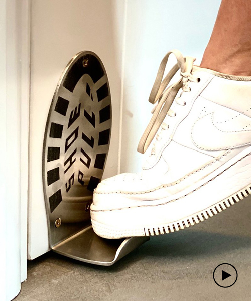 'shoe pull' is a foot operated door handle that leaves your hands clean and free