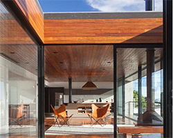 stacked concrete + wooden volumes form pimont arquitetura's 'casa cacupé' in brazil