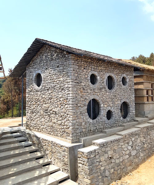 supertecture uses donated bricks from earthquake ruins to extend a school in nepal