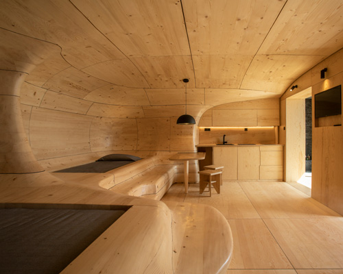 tenon architecture sets sculptural wooden cave within greek mountain resort