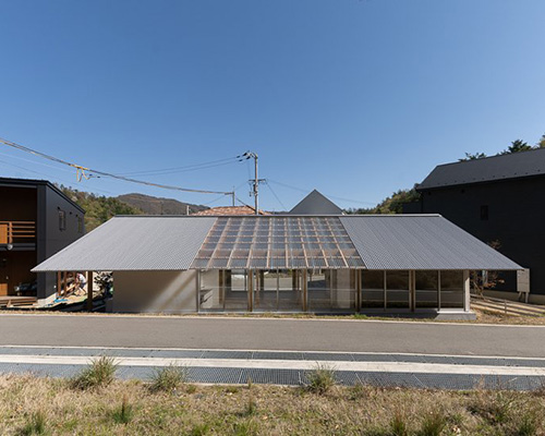 yasuyuki kitamura designs residence in minoh, japan with wooden frame and roof windows