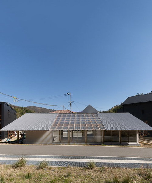 yasuyuki kitamura designs residence in minoh, japan with wooden frame and roof windows