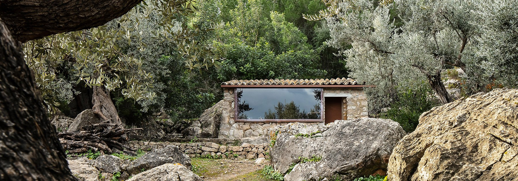 studio mar plus ask finishes its cavernous stone 'olive houses' with hyper-modern interiors