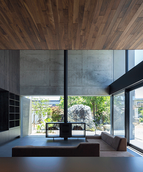 apollo architects builds concrete dwelling with rock garden in japan