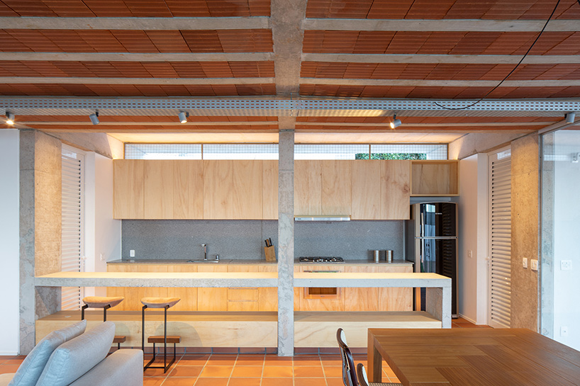 experimental brasília residence by bloco arquitetos comprises ten concrete porticoes