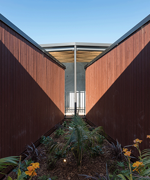a natural ventilated childcare centre settles within new zealand's countryside