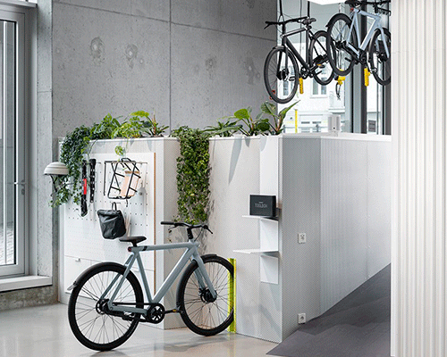 concrete walls + steel counters complete urban bike store interior by ninetynine in berlin