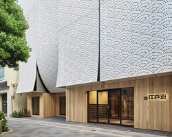 kubo tsushima architects renovates and extends 'edoyu' spa in tokyo with curtain-like façade