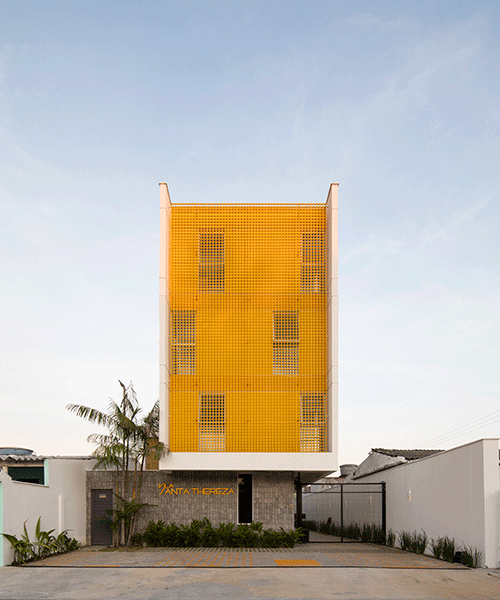 laurent troost adds bright yellow metal lattice facade to apartment complex building in brazil