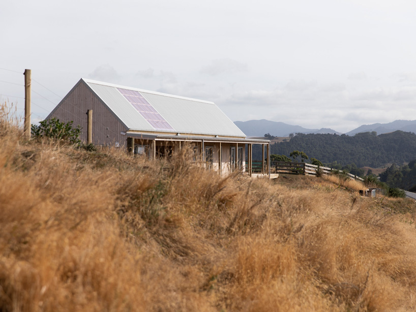 the prefab house by MAKE architects is perched on a hilltop
