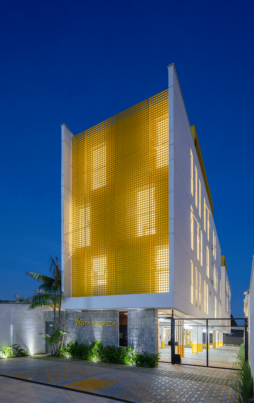 laurent troost adds bright yellow metal lattice facade to apartment ...