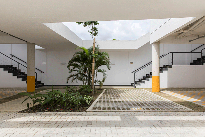 laurent troost adds bright yellow metal lattice facade to apartment complex building in brazil