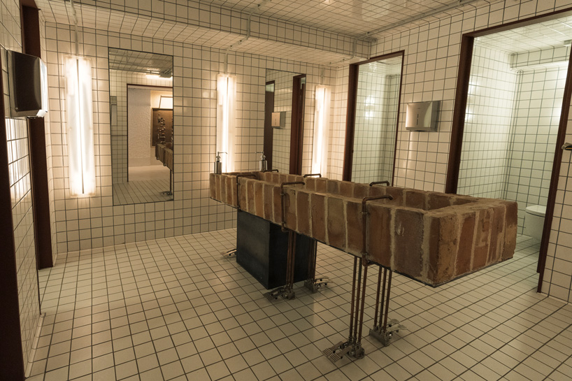 a central, handmade brick washing basin in the toilets