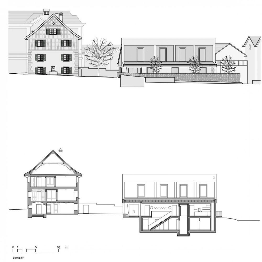 asymmetrical pitched roof tops parish hall by joos & mathys + daniel nyffeler in switzerland