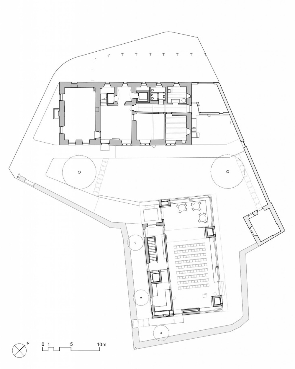 asymmetrical pitched roof tops parish hall by joos & mathys + daniel nyffeler in switzerland