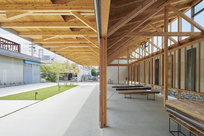 ninkipen! completes gallery for veneer company with deep overhangs in yao, japan