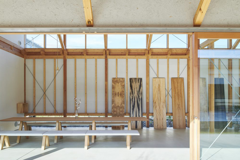 ninkipen! completes gallery for veneer company with deep overhangs in yao, japan