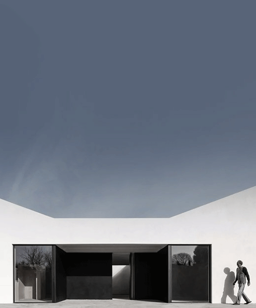 OAB shapes artists' residence in spain as simple, white pavilion set with void courtyards