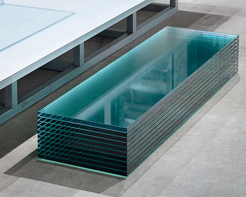 oniki adds stage with laminated glass steps within clothing store interior in japan