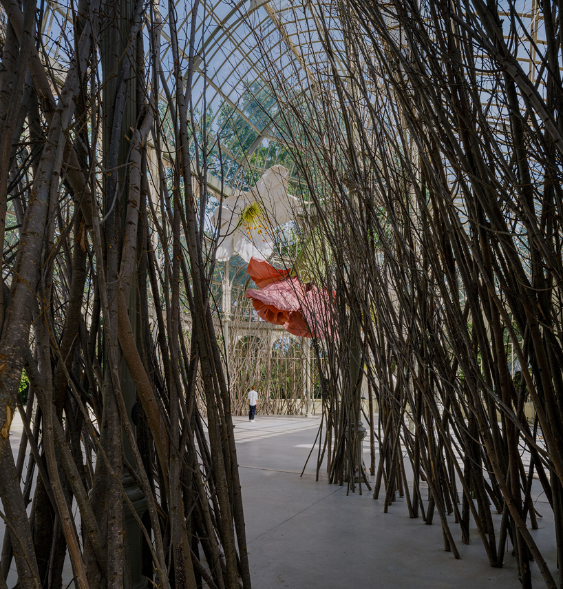 petrit halilaj turns madrid's palacio de cristal into nest of giant flowers