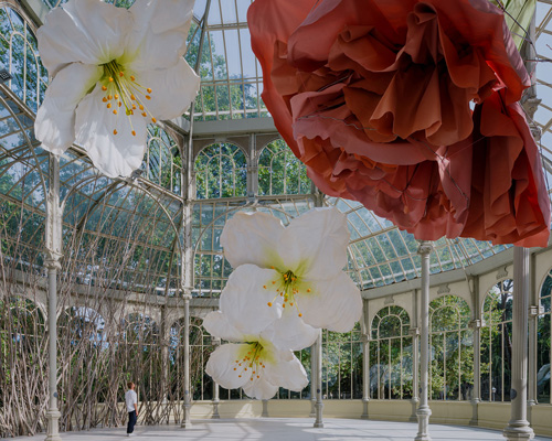 petrit halilaj turns madrid's palacio de cristal into nest of giant flowers