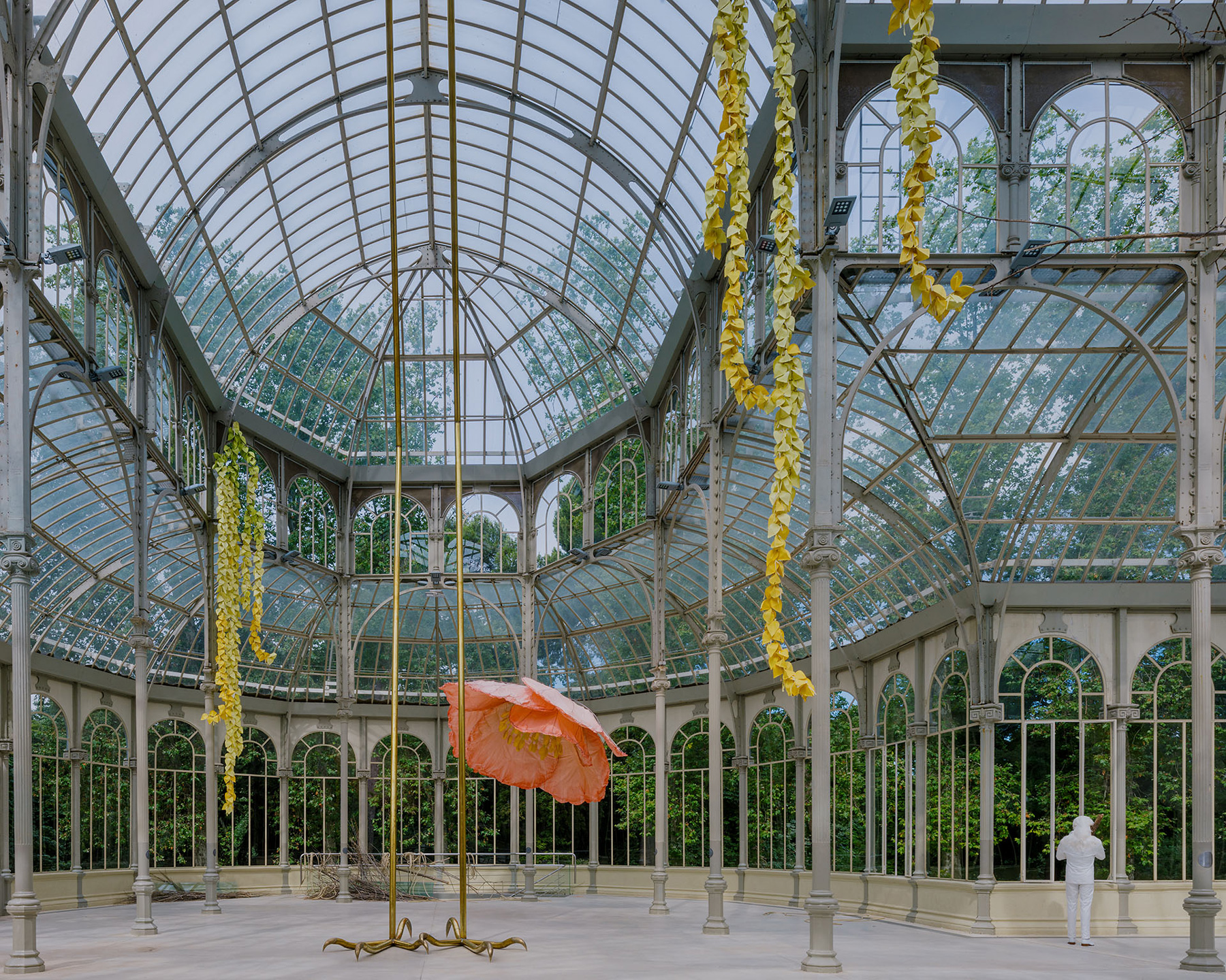 petrit halilaj turns madrid's palacio de cristal into nest of giant flowers