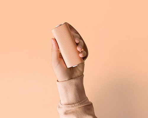 this portable cylindrical hand warmer device can charge your phone