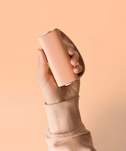 this portable cylindrical hand warmer device can charge your phone