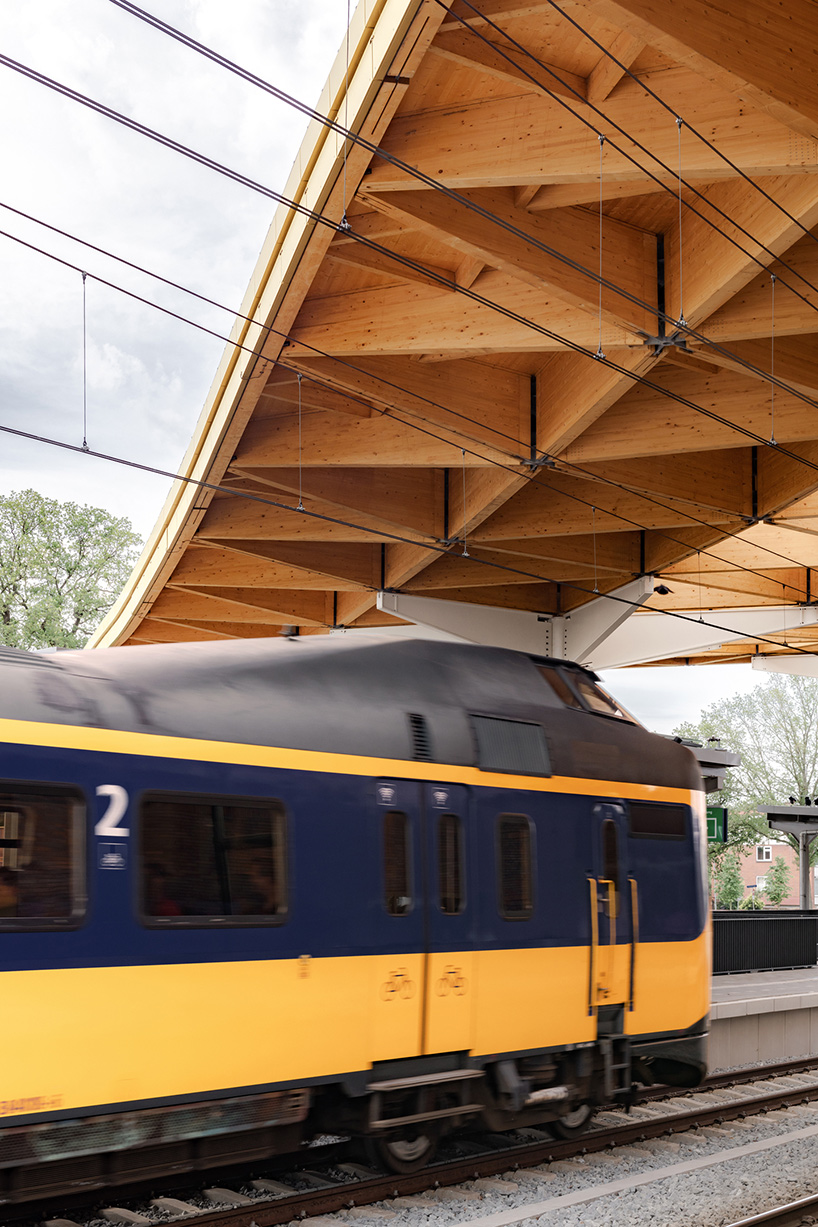 powerhouse company + de zwarte hond unite assen station with triangular wooden roof