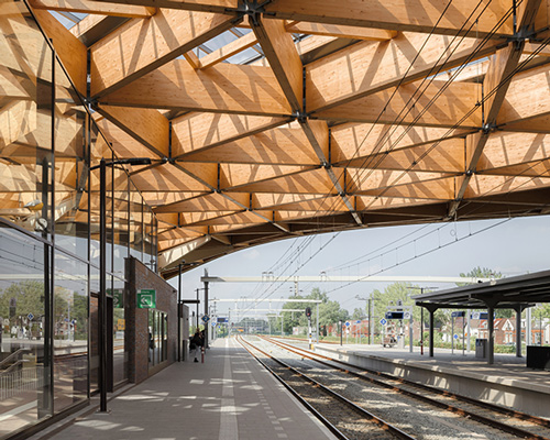 powerhouse company + de zwarte hond unite assen station with triangular wooden roof