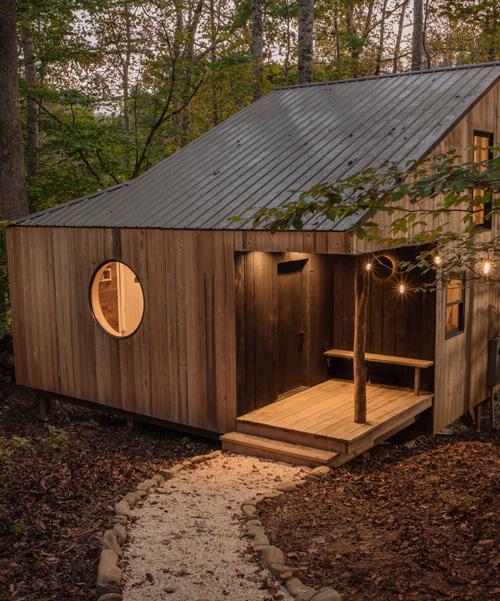 local materials + traditional craft techniques make shelter's tiny 'nook' cabin in north carolina