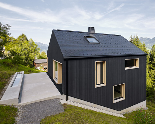 stefan schweighofer wraps austrian holiday house in black wood
