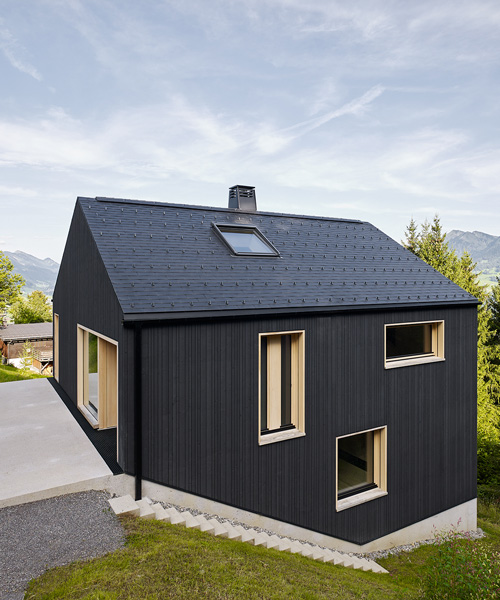 stefan schweighofer wraps austrian holiday house in black wood