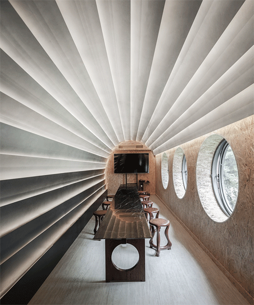stone plates and round windows complete exhibition hall + teahouse in shanghai