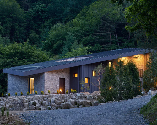 studio EON tops house in south korea with sloped surface that doubles as roof + façade