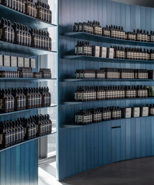 torafu architects adds indigo wooden walls within aesop store interior in japan