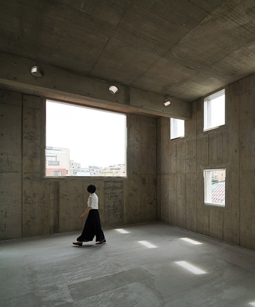 torafu architects completes rental building in tokyo with high-ceiling concrete interiors