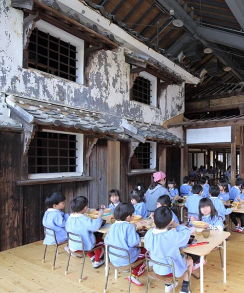shigeru aoki builds a kindergarten over a 100-year-old wooden house in japan