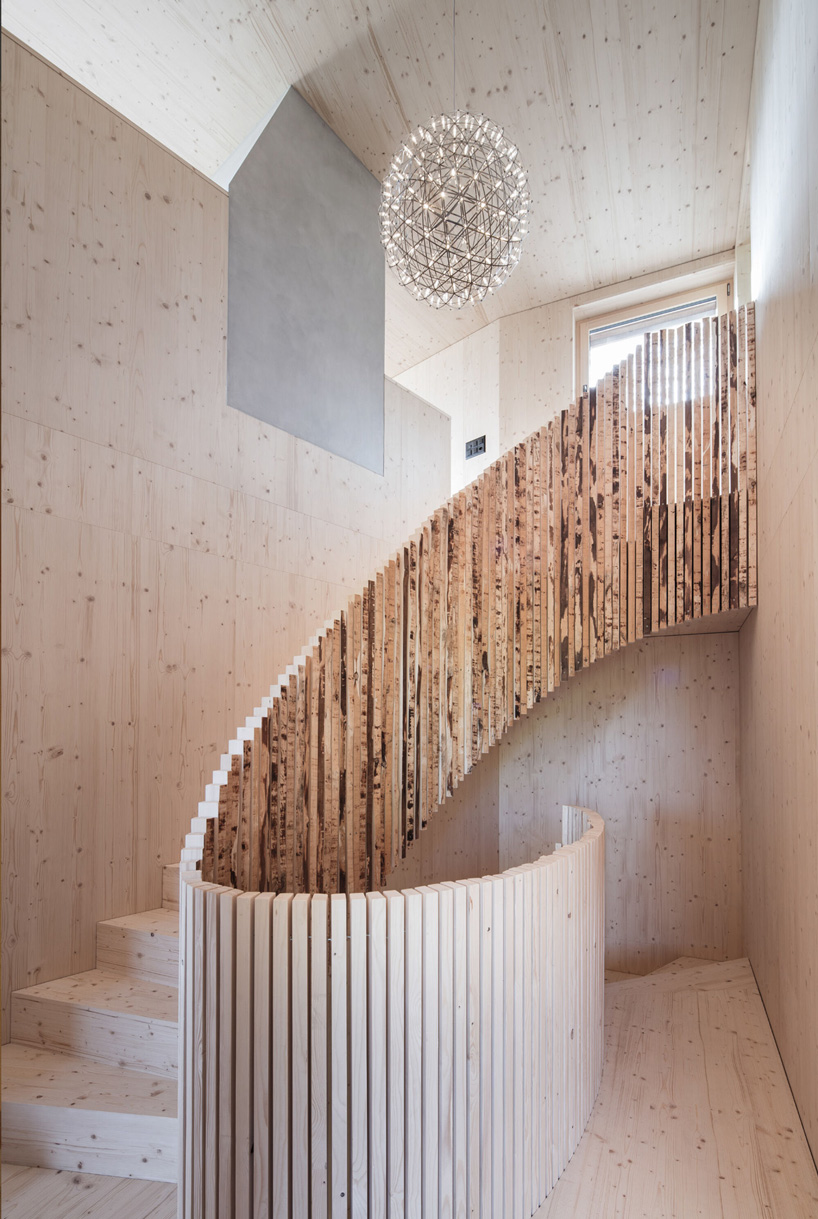 a curving timber staircase inside