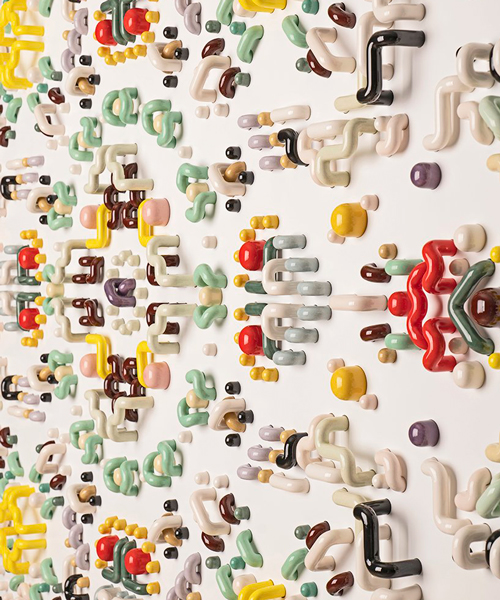 BATIT studio applies 2000 handmade ceramic pieces to create a colorful wall carpet