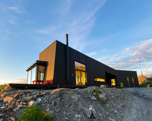 'senja' cabin by bjørnådal arkitektstudio takes the form of norwegian stones + mountains