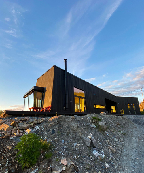 'senja' cabin by bjørnådal arkitektstudio takes the form of norwegian stones + mountains