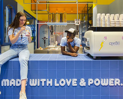 bright color contrasts + graphic lettering realize ice cream store by studiomateriality in greece