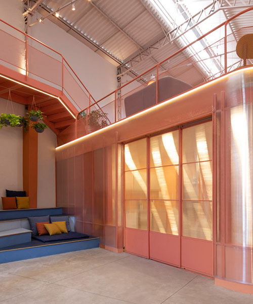 colorful booths + mezzanine balconies form office space for dental health company in brazil