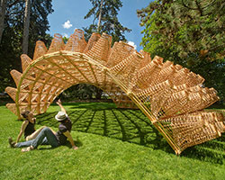 DJA introduces triangular wicker mesh pavilion in france, woven by latvian craftsmen