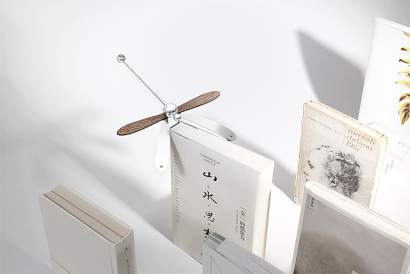 this dragonfly diffuser set balances on its beak while spreading gentle aromas
