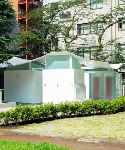 fumihiko maki designs the 'squid toilet' in tokyo with a courtyard and curved roof