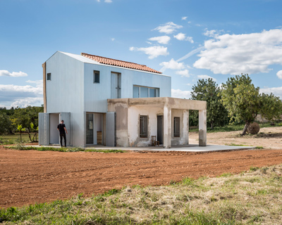 exposed masonry and corrugated metal sheeting makes up alberto facundo's 'la caseta'