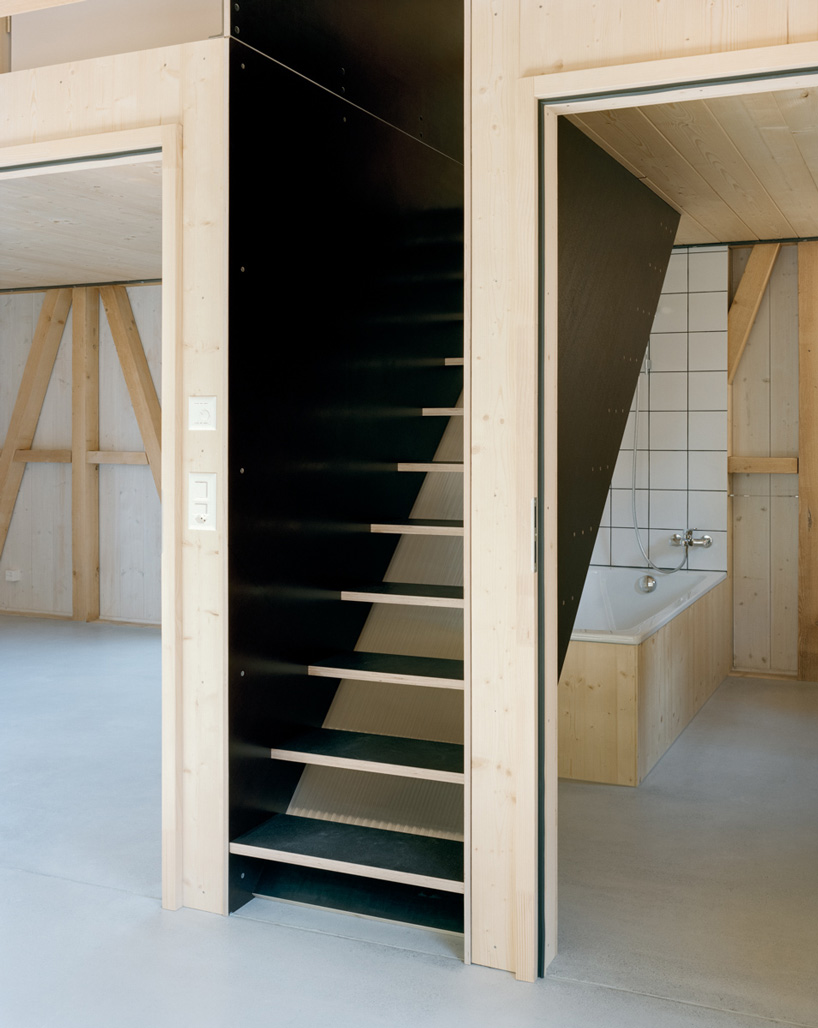 lukas lenherr transforms storage building into small timber house in switzerland