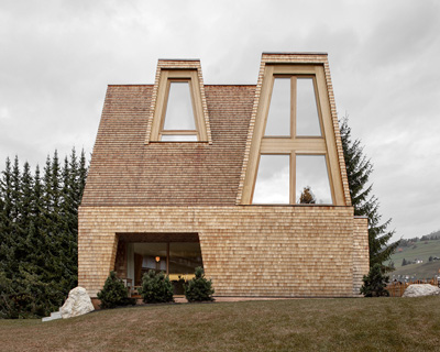 pedevilla architects clads alpine family residence in hand-split larch shingles in south tyrol